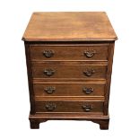 Small wooden chest of four drawers with brass swan neck handles. 61 h x 49 w x 46 cm deep.