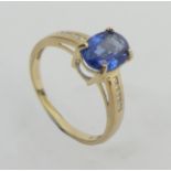 9ct gold blue topaz and diamond ring, 2 grams. Size N, 8.1 mm wide. UK Postage £12.