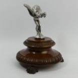 Rolls Royce Spirit of Ecstacy car mascot mounted on a mahogany stand. 20 cm high. UK Postage £14.