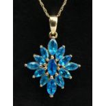 A 9ct gold blue neon apatite cluster pendant and chain, 2.4 grams. 26 mm long. UK Postage £12.