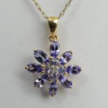 9ct gold tanzanite pendant and chain, 2.5 grams. Pendant 23 mm long. UK Postage £12.