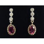 A pair of 9ct gold rubellite and diamond earrings, 2 cm long. UK Postage £12.