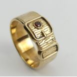 9ct gold garnet set buckle ring, Birm.1970, 8.8 grams. Size X 1/2, 10.6 mm. UK Postage £12.