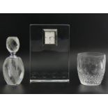 Waterford cystal mantle clock and whisky tumbler along with a chrome and cut glass perfume bottle.
