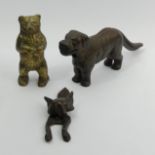 A brass bear money box, a fox design door knocker and a dog design nutcracker. UK Postage £15.