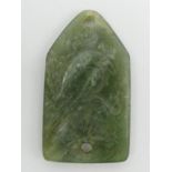 Chinese jade pendant/belt fastener, carved with a bird amongst foliage. 60 x 35 mm. UK Postage £12.