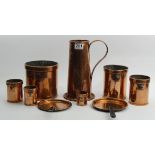 A 19th century set of copper measures, two copper sauce pan lids and a single handled 25.5 cm jug "