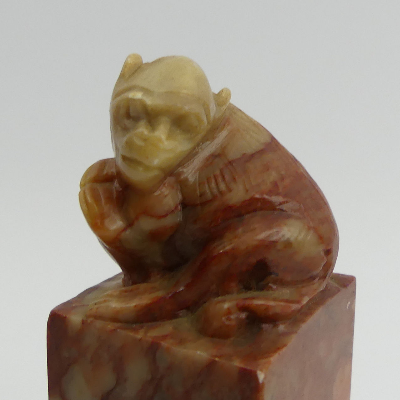 A Chinese carved soapstone seal with a monkey to the top. 9.5 cm. UK Postage £12. - Image 3 of 4