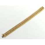 18ct gold fancy design bracelet, 34.9 grams. 19 cm x 14 mm. UK Postage £12.