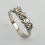18ct white gold four stone diamond ring, 3.9 grams. Size T 1/2, 4.8 mm wide. UK Postage £12.