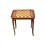 An inlaid walnut games table, the interior fitted and with games pieces. Postage not available.