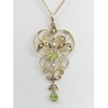 9ct gold peridot and seed pearl pendant and chain, 3 grams. Chain 42 cm, pendant 4.8 cm. UK
