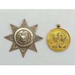 Antwerp Concours International medal and a Victorian silver Foresters star shaped buckle, Birm.1884.