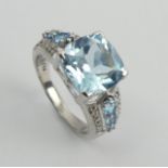 Sterling silver blue topaz and diamond ring, 5 grams. Size N 1/2. UK Postage £12.