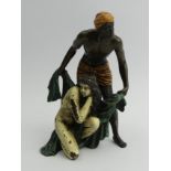 Austrian cold painted bronze figure group, depicting a man in the process of covering a naked