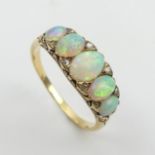 18ct gold, tested, opal five stone ring with diamond points. 3.9 grams, Size Q1/2, 7.4mm wide. UK