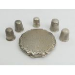 Fire silver thimbles various dates and a silver 835 compact, 74 grams, compact 65mm. UK Postage £12.