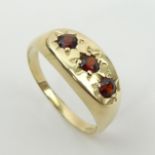 9ct gold three stone garnet ring, 3.4 grams. Size v, 9 mm. UK Postage £12.