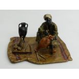 Austrian cold painted bronze Arab potter on a rug figure. 6 x 9.5cm. UK Postage £12