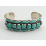 Sterling silver and turquoise Native American cuff bangle, Buffalo head mark, 53.9 grams, 20mm wide