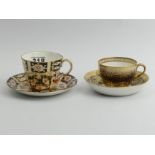 Early 19th Century Spode porcelain cabinet cup and saucer and a Royal Crown Derby 2451 Imari cup and