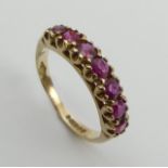 9ct gold seven stone ruby ring, 2 grams, size L 4.5mm wide. UK Postage £12.