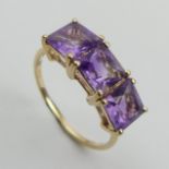 9ct gold amethyst three stone ring, 2.5 grams. Size Q, 7.4 mm. UK Postage £12.