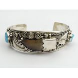Native American silver turquoise and claw set cuff bangle, 45.5 grams, 25mm wide. UK Postage £12