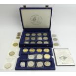 A display box of various Royal Mint coins including Crowns some with Certificates. UK Postage £14
