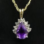 9ct gold amethyst pendant and chain, 1.4 grams, pendant 16mm, chain 45cm. UK Postage £12
