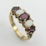 9ct gold opal and garnet ring, 4.1 grams, 8.5mm, Size Q1/2. UK Postage £12.