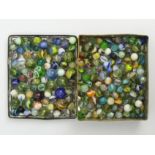 A tin of coloured marbles, tin 17cm x 14cm x 4.5cm, UK Postage £12.