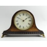 Edwardian Oak cased mantel clock on brass feet, 21 x 14 x 8cm. UK Postage £12 Condition Report: In