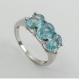 9ct white gold three stone blue topaz ring, 2.8 grams, 7.3mm wide, Size N1/2