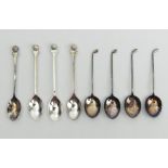 Eight silver golfing design spoons, 68.6 grams, 10.4cm x 9.4cm, UK Postage £12.