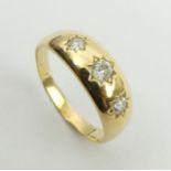 18ct gold three stone diamond gipsy ring, (approx. 1/2 ct total diamond weight), 5.6 grams, 7.3mm,