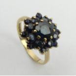 9ct gold sapphire cluster ring, Birm. 1980, 3.4 grams, 14mm, size Q. UK postage £12