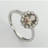 9ct white gold tourmaline and diamond ring, 2.1 grams, 10.2mm, size N1/2. UK Postage £12.