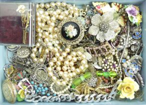 A box of mixed costume jewellery including some silver. UK Postage £12