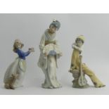 A Nao figurine of a Pierrot, a girl with a cake and an oriental lady with a fan, 26cm. UK Postage £