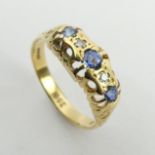18ct gold three stone sapphire and diamond ring, 3.1 grams, 6.9mm, size O. UK postage £12