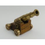 Brass model cannon on an oak carriage, 17cm long. UK Postage £12.