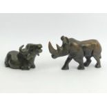 A carved soapstone figure of a rhino and a soapstone figure of a water buffalo, rhino 9.5cm high x