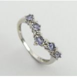 9ct white gold tanzanite and diamond ring, 1.8 grams, 3.3mm, size M1/2. UK postage £12