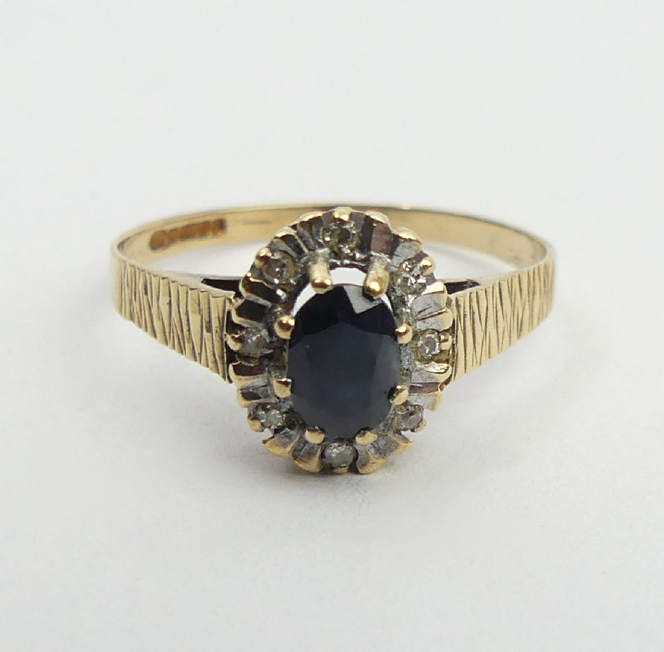 9ct gold sapphire and diamond ring, Birm. 1985, 1.8 grams, 10.2mm, size P1/2. UK postage £12. - Image 2 of 6