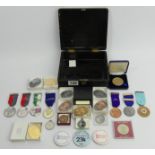 A Chinese Lacquer box containing various shooting medals. UK Postage £12.