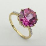 9ct gold pink sapphire and diamond ring, 2.9 grams, 11.9mm, size N1/2. UK Postage £12.