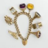 9ct gold heavy charm bracelet,185.3 grams, chain width 8.5mm. UK postage £12.