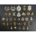 A selection of military cap badges, including Argyll & Sutherland. UK Postage £12.