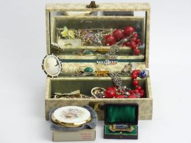 A jewellery box and contents, including a Stratton compact and a Victorian brooch. UK Postage £12.
